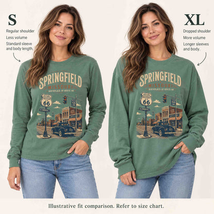 Illustrative S versus XL fit comparison of the Light Green Springfield long sleeve tee on a woman, showing shoulder, sleeve and length differences.