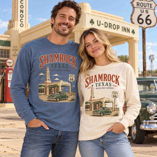Man in Blue Jean and woman in Ivory wearing Shamrock Texas Route 66 long sleeve tees in front of the U-Drop Inn with a classic green car.