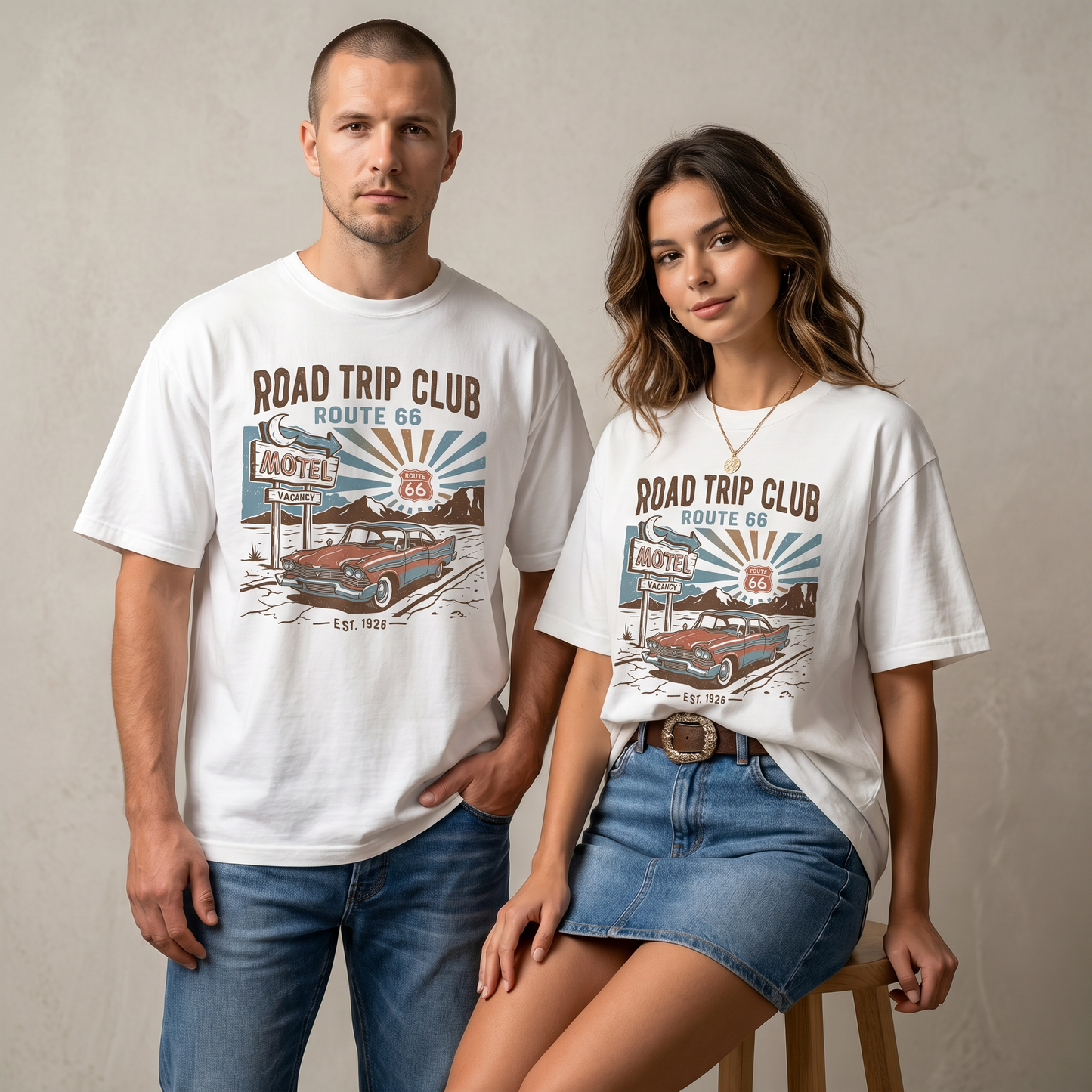 Route 66 Road Trip Club graphic tee featuring a vintage motel sign, classic car, desert highway landscape, sunburst background, and Est. 1926 text.
