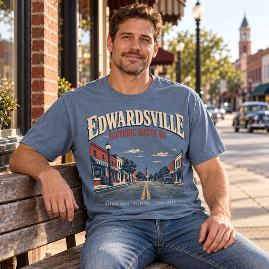 Woman seated in a Light Green Edwardsville Historic Route 66 graphic tee with vintage Illinois Mother Road artwork