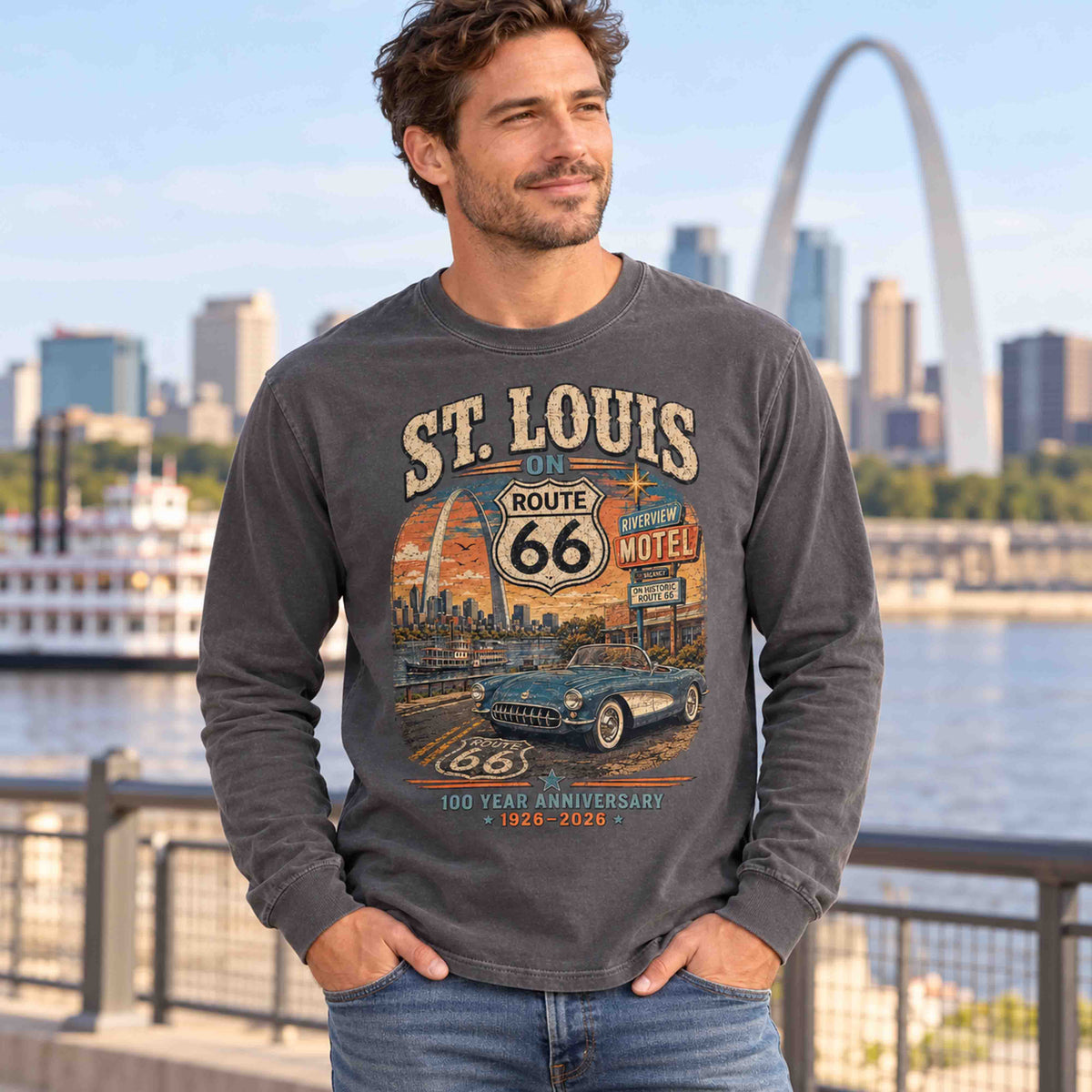 Man wearing a Pepper St. Louis Route 66 long sleeve tee beside the riverfront, with the Gateway Arch in the background.