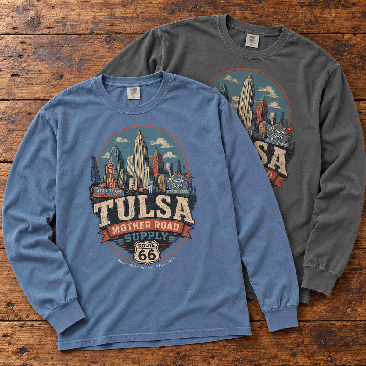Blue Jean and Pepper Tulsa Route 66 long sleeve graphic tees arranged flat on a wooden table.