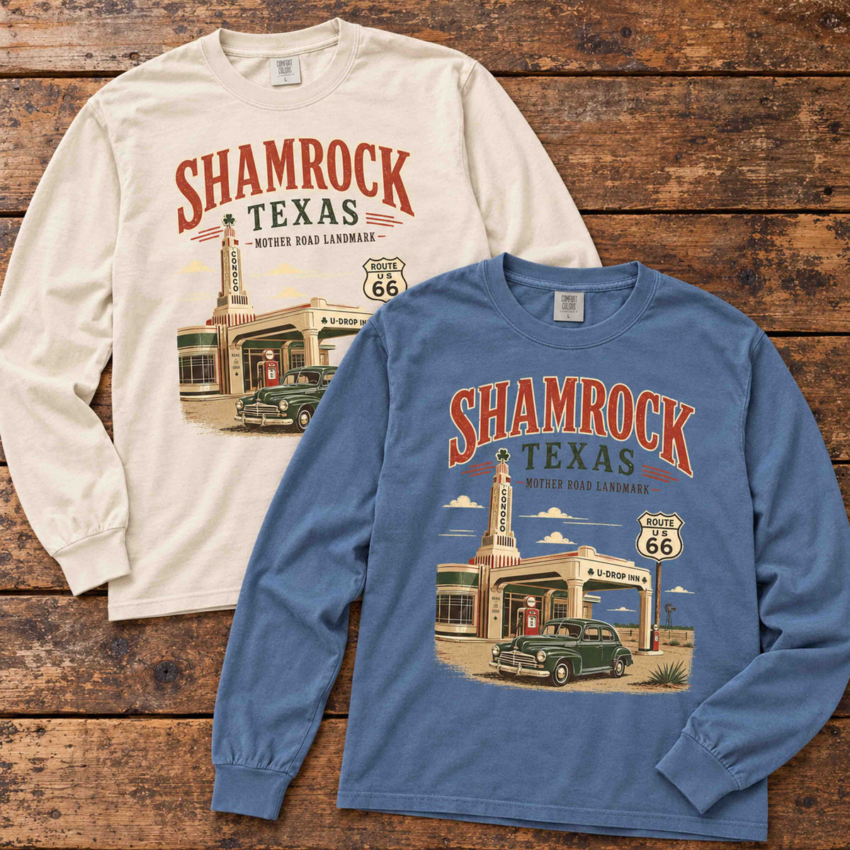 Ivory and Blue Jean Shamrock Texas Route 66 long sleeve graphic tees arranged flat on a wooden table.