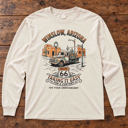Ivory Winslow Route 66 long sleeve tee laid flat on wood, showing the vintage truck and centennial graphic.