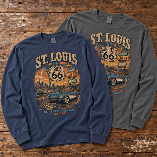 Navy and Pepper St. Louis Missouri Route 66 long sleeve graphic tees arranged flat on a wooden table.