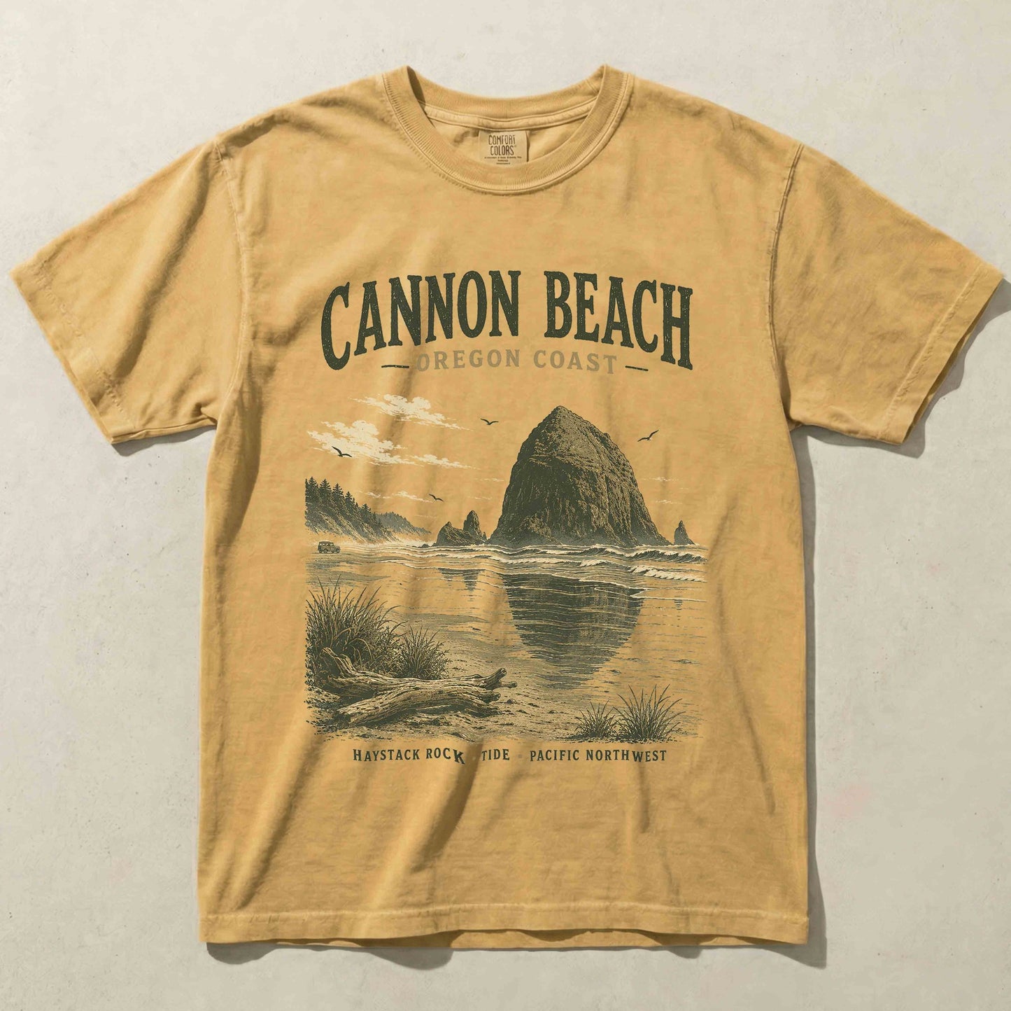 Cannon Beach Oregon Coast graphic t-shirt in Mustard featuring Haystack Rock