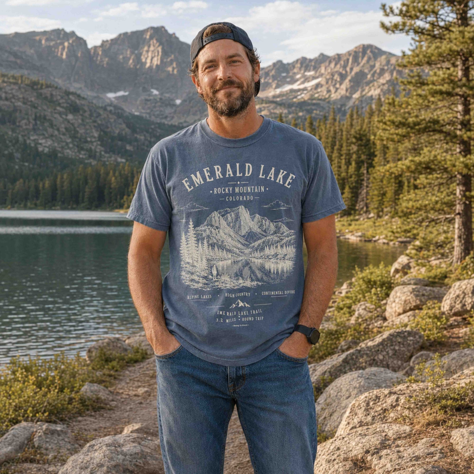 Man wearing a Blue Jean Emerald Lake Rocky Mountain National Park T-shirt