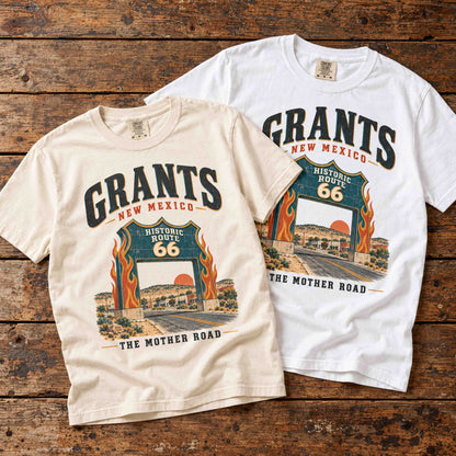 Ivory and White Grants Route 66 tees overlapping on a wooden table