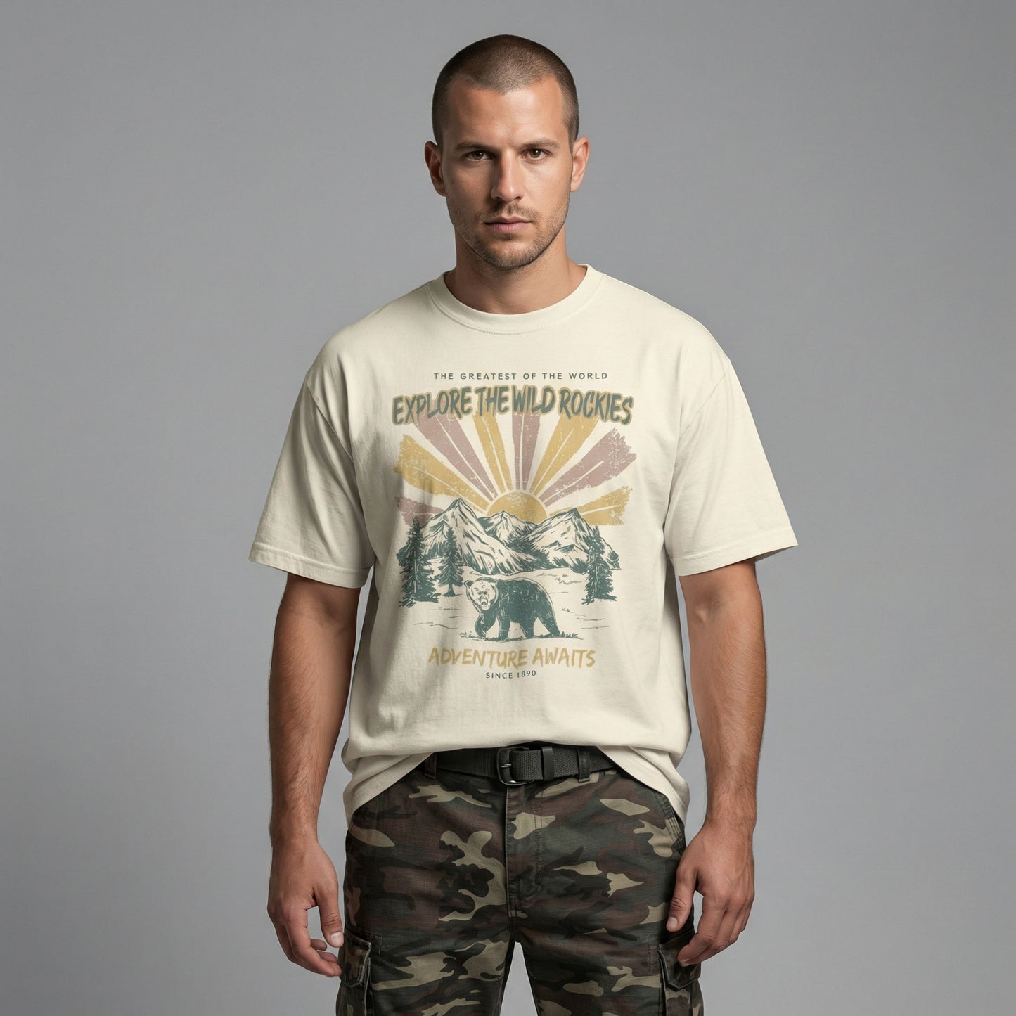 Straight-on view of a man modeling a cream everyday-fit t-shirt with a retro mountain and bear illustration.