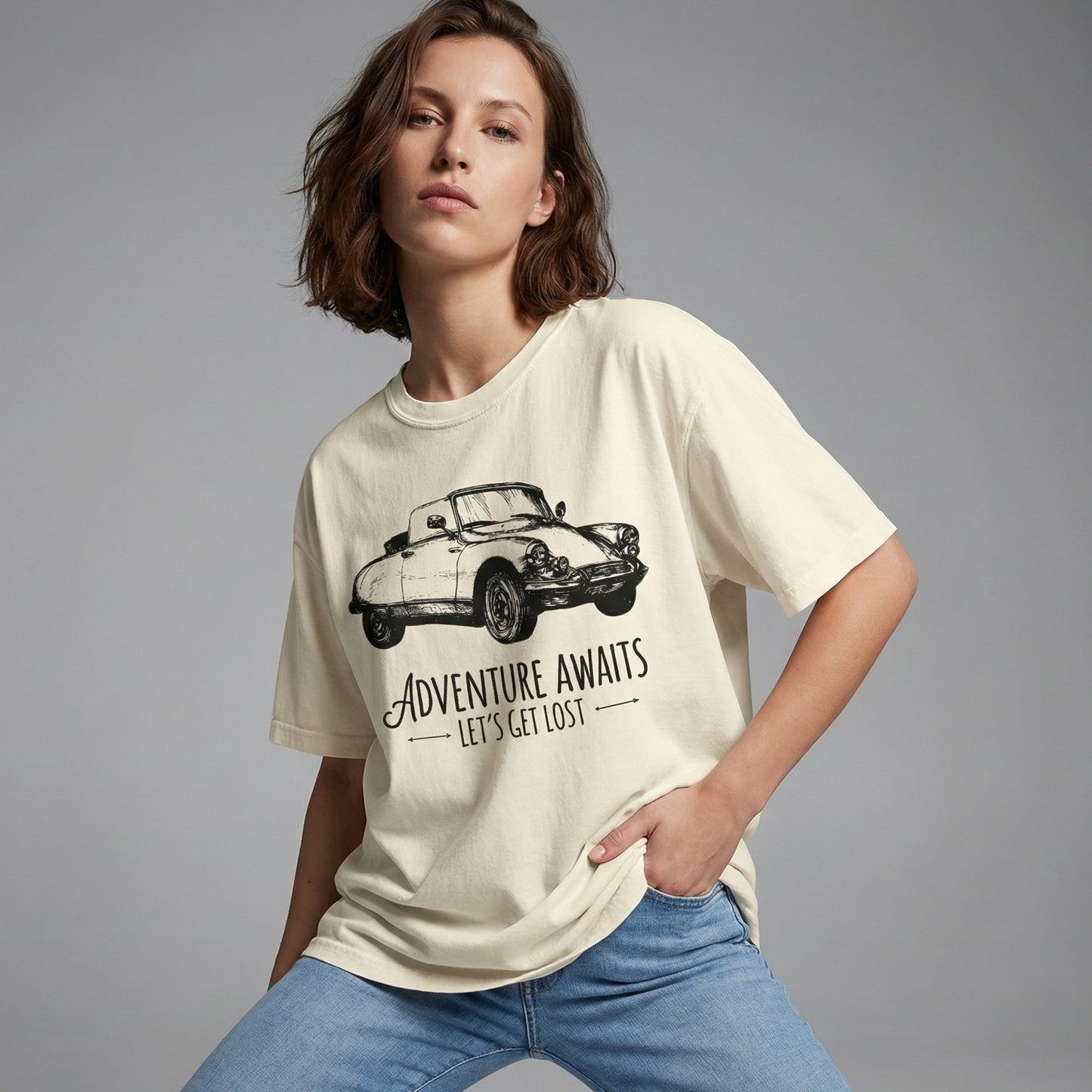 "Adventure Awaits premium lifestyle tee featuring classic convertible and road trip design"
