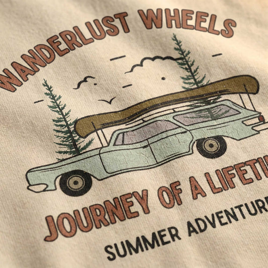 "Close-up detail of vintage station wagon and canoe graphic print on premium cotton t-shirt"
