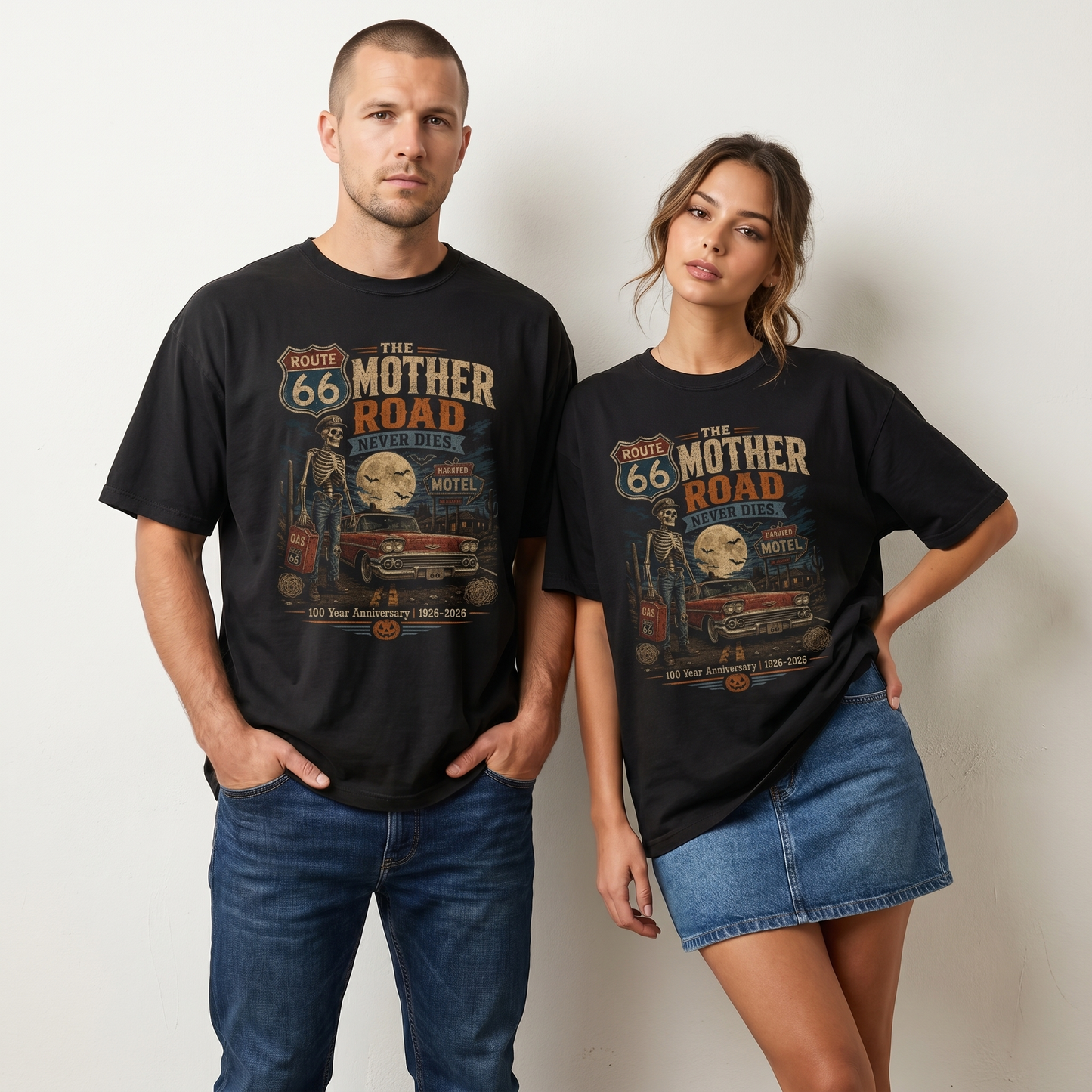Unisex black Route 66 Halloween graphic tee featuring The Mother Road Never Dies artwork with skeleton, classic car, haunted motel, moon, bats, and 1926–2026 anniversary text.