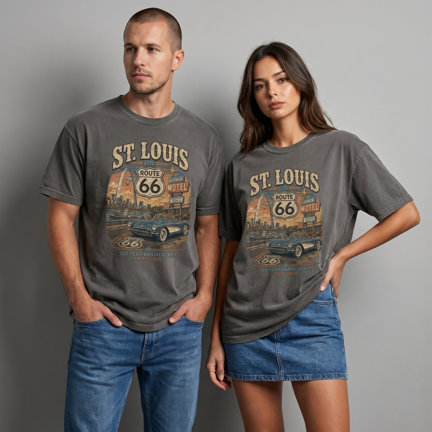 Man and woman wearing St. Louis on Route 66 centennial graphic t-shirts in gray