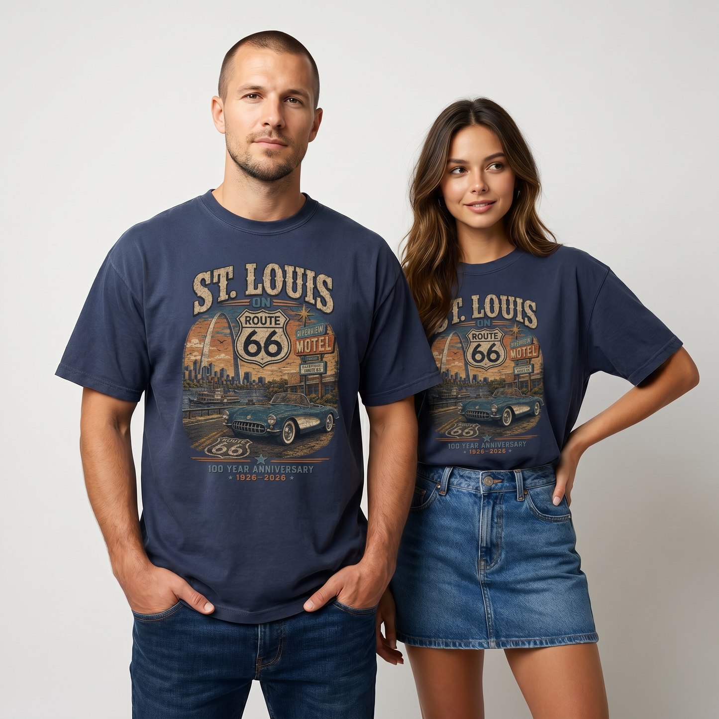 Man and woman modeling St. Louis on Route 66 100 year anniversary graphic tees in Navy