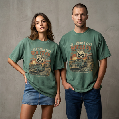 Unisex Oklahoma City Route 66 graphic tee featuring vintage pickup truck, Route 66 shield, motel sign, sunset landscape, and 1926–2026 anniversary artwork.