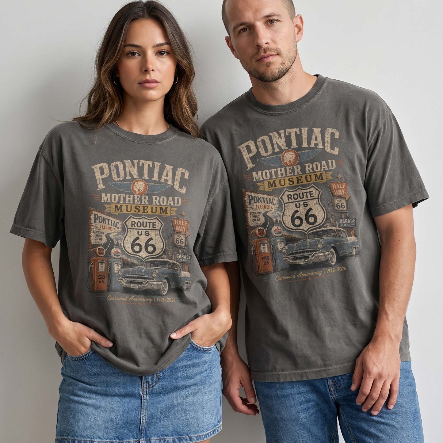 Unisex Pontiac Illinois Route 66 graphic tee featuring Mother Road Museum text, Route 66 shield, vintage gas pumps, classic car artwork, and 1926–2026 centennial text.