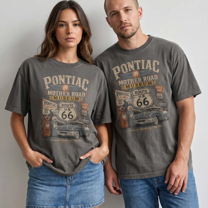 Unisex Pontiac Illinois Route 66 graphic tee featuring Mother Road Museum text, Route 66 shield, vintage gas pumps, classic car artwork, and 1926–2026 centennial text.
