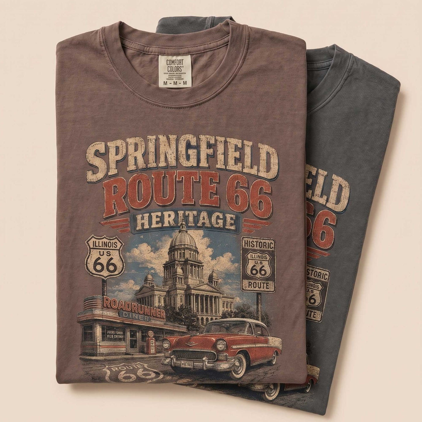 Unisex Springfield Illinois Route 66 graphic tee featuring historic architecture, Illinois Route 66 shield, roadside diner, classic car, and 1926–2026 Mother Road anniversary text.