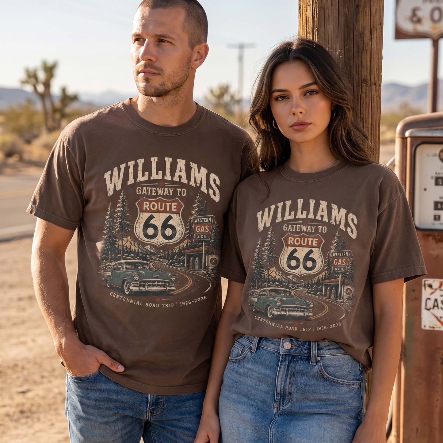 Unisex Williams Arizona Route 66 graphic tee featuring Gateway to Route 66 text, pine trees, mountain road scenery, vintage gas station, classic car, and 1926–2026 centennial details.