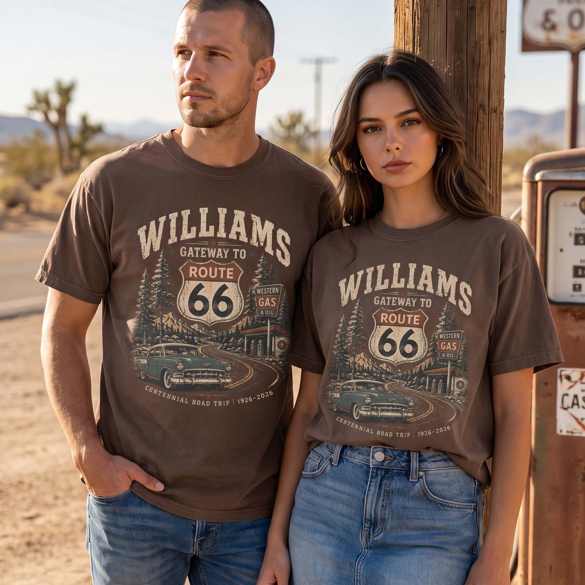 Unisex Williams Arizona Route 66 graphic tee featuring Gateway to Route 66 text, pine trees, mountain road scenery, vintage gas station, classic car, and 1926–2026 centennial details.