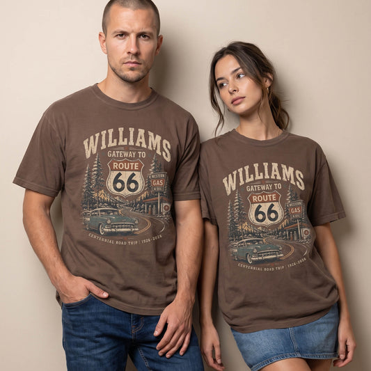 Unisex Williams Arizona Route 66 graphic tee featuring Gateway to Route 66 text, pine trees, mountain road scenery, vintage gas station, classic car, and 1926–2026 centennial details.
