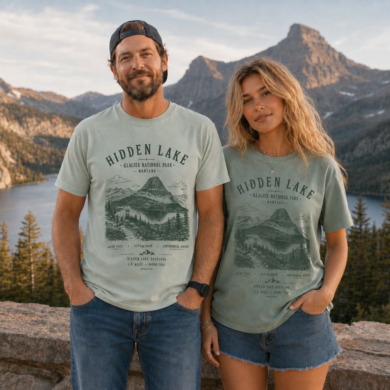 Couple wearing Hidden Lake Glacier National Park graphic tees in mountain scenery