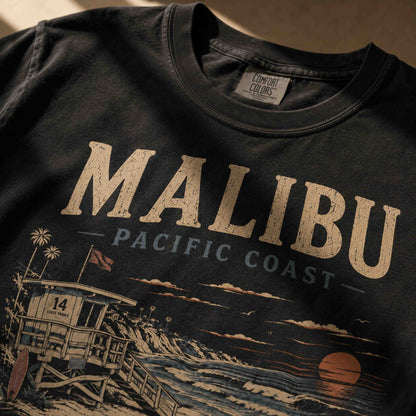 Close-up of Malibu Pacific Coast graphic print on Black t-shirt