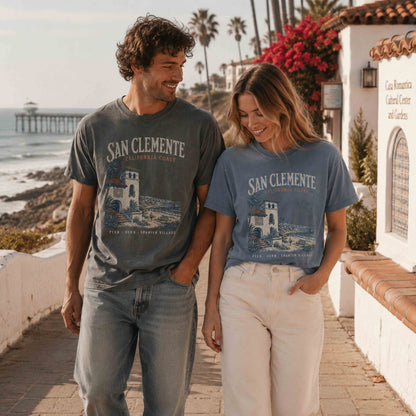 San Clemente California Coast graphic t-shirt in Pepper and Blue Jean on a couple near Casa Romantica and the pier