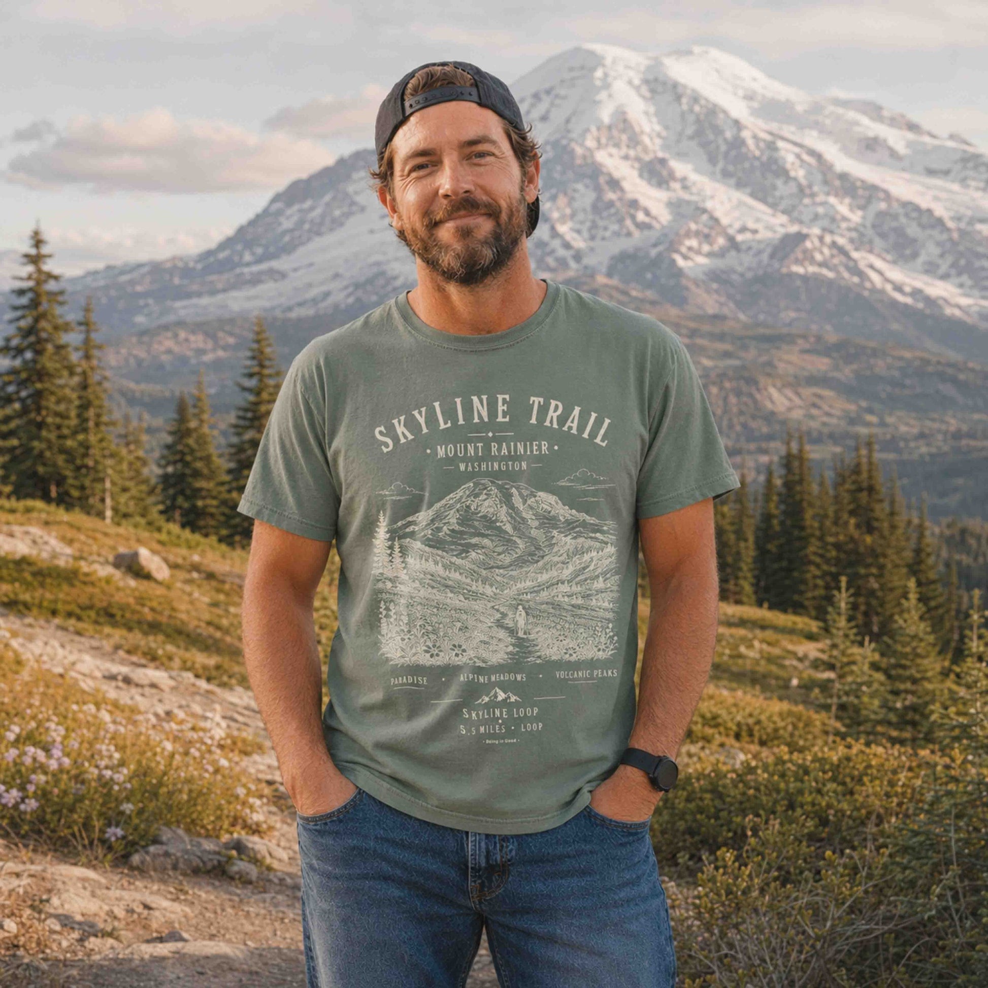 Man wearing a Moss Skyline Trail Mount Rainier graphic T-shirt