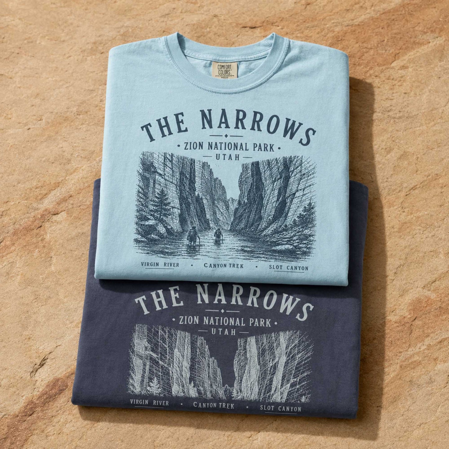 The Narrows Chambray and Navy Comfort Colors t-shirts folded